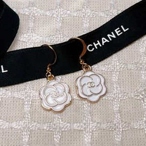 Chanel white camelia earrings